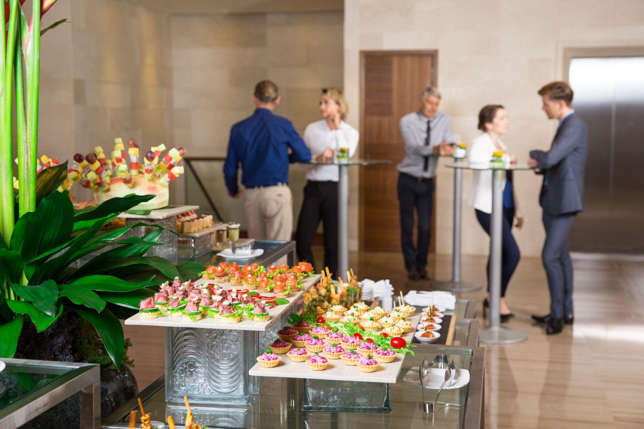 Corporate event catering setup with live food stations
